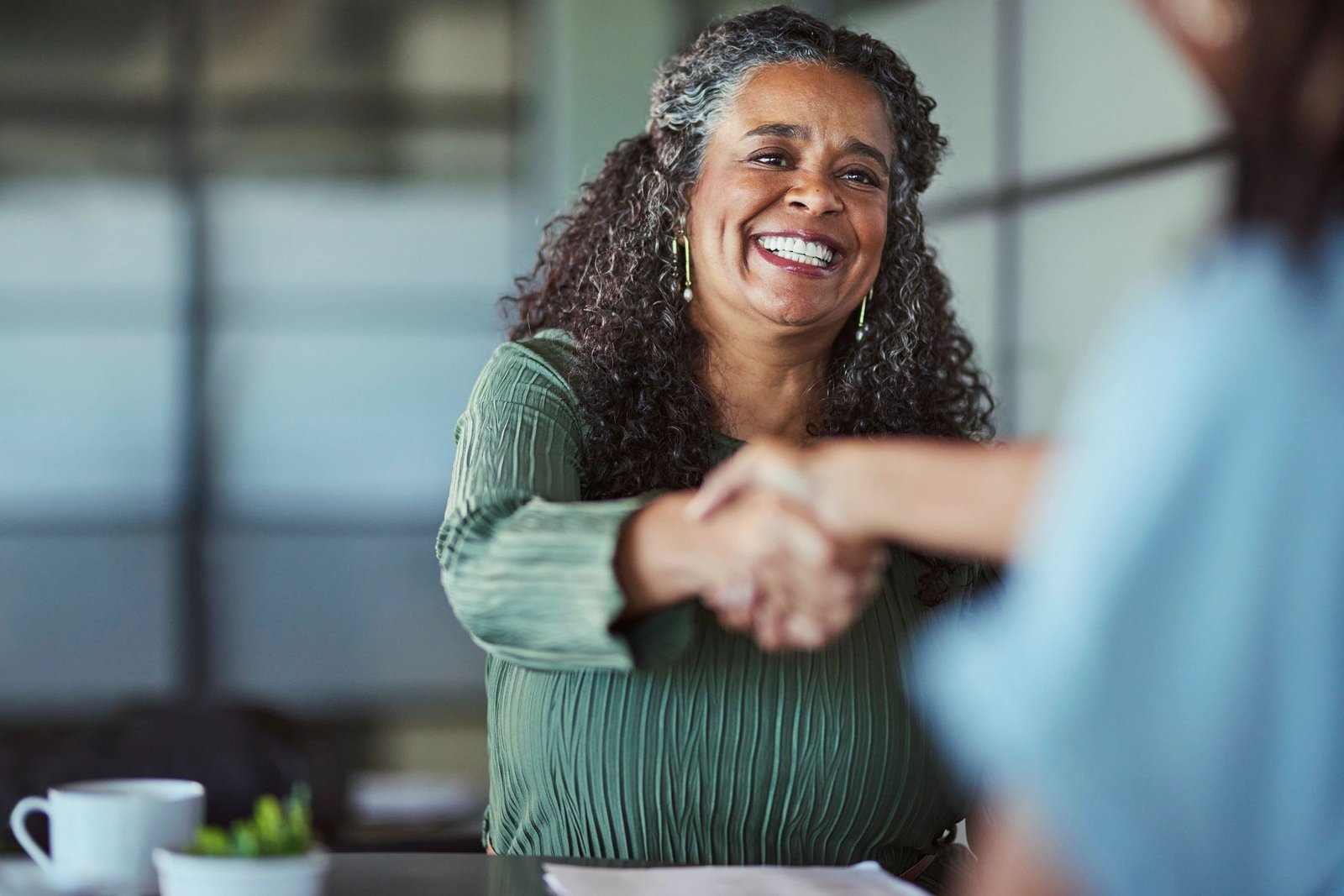 Professional handshake after an interview in an office